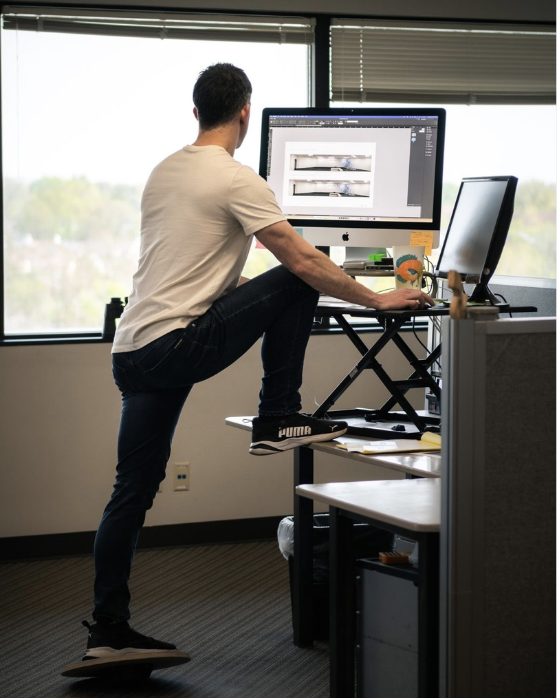 Man with foot on his desk, man, foot, desk